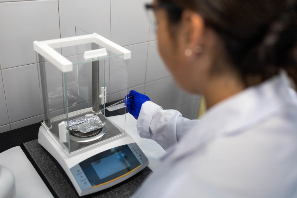 WEBPConverter - scientist-weighing-sample-scale.webp